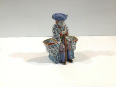 A French faience figural double salt, late 19th century, possibly Fourmaintraux, Desvres, modelled