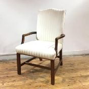 A 19th century mahogany framed armchair, the back and seat upholstered in a pale striped fabric,