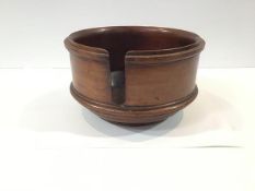 A mahogany table top plate stand or holder, circular, with moulded and turned bands. 17cm by 29.5cm