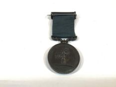 A Royal Humane Society bronze medal awarded to Alfred Martin, January 25th, 1903, with ribbon and