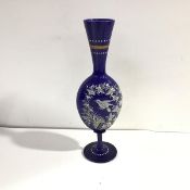 A 19th century enamel painted blue glass vase, of flattened spherical form, with elongated