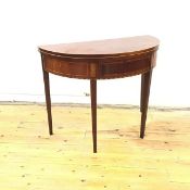 A Scottish George III mahogany and rosewood banded tea table, of semi-elliptical form, the hinged