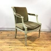 A French painted fauteuil, c. 1900, with fluted roller top rail and downswept arms enclosing a