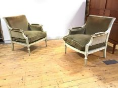 A pair of French painted bergere armchairs, c. 1900, each with fluted roller top rail and