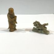A Chinese carved soapstone figure of a standing figure, possibly Shoulao, modelled holding a