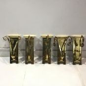 A pair of brass wall sconces, first half of the 20th century, the fielded back plate issuing two