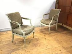 A pair of French painted fauteuils, c. 1900, each with fluted roller top rail and downswept open