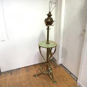 A striking brass and onyx floor lamp, c. 1900, in the Art Nouveau taste, converted from an oil lamp,