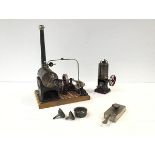 A Gebruder Bing tinplate toy stationary steam engine, mounted on a tiled base, with maker's