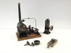 A Gebruder Bing tinplate toy stationary steam engine, mounted on a tiled base, with maker's