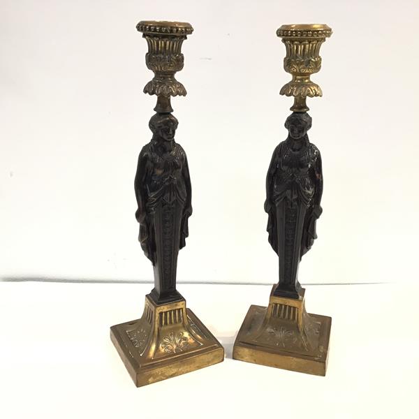 A pair of gilt- and patinated bronze caryatid candlesticks in the Empire taste, 20th century, each