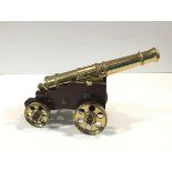 A bronze model naval cannon, early 20th century, the tapering multi-stage barrel with flared muzzle,