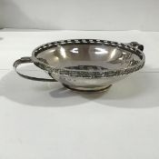A silver twin-handled bowl in the Arts & Crafts taste, G.L. Connell Ltd, Birmingham 1915,