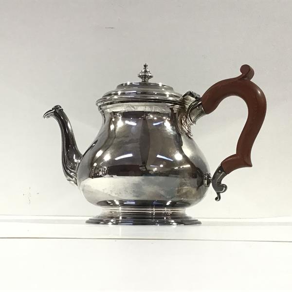 A silver teapot, C.J. Vander Ltd, London 1964, of squat baluster form, the stepped domed cover
