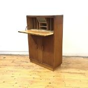 A 1930's secretaire desk by Robert John Anderson of Edinburgh, the rectangular top above a fall