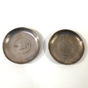 Two Chinese coin-inset silver dishes, early 20th century: the first with a Hsuan Tung dollar