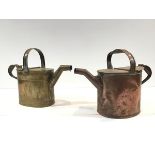 Two late 19th century watering cans, one copper, the other brass, of the same design with fixed loop