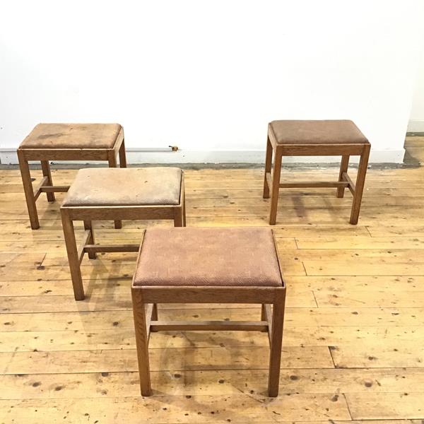A set of four 1930's oak stools by Robert John Anderson of Edinburgh, each rectangular frame with