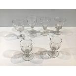 A group of 19th century drinking glasses comprising: a rummer with cup-shaped bowl, with thumb-cut