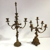 Two 19th century gilt-bronze figural candelabra: the first of five lights, each baluster candle