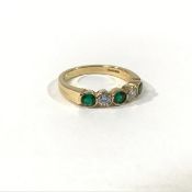 An emerald and diamond five-stone ring, the three uniform collet-set round-cut emeralds spaced by