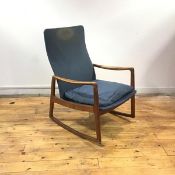 Ole Wanscher for France & Sons, a teak rocking chair, the shaped back and cushioned seat enclosed by