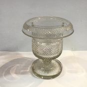 A 19th century cut-glass wine cooler, of urn form, with everted rim, on a circular star-cut foot,