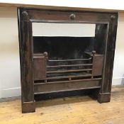 A Scottish mid-19th century steel fire insert, the fielded frame decorated with raised bosses, and