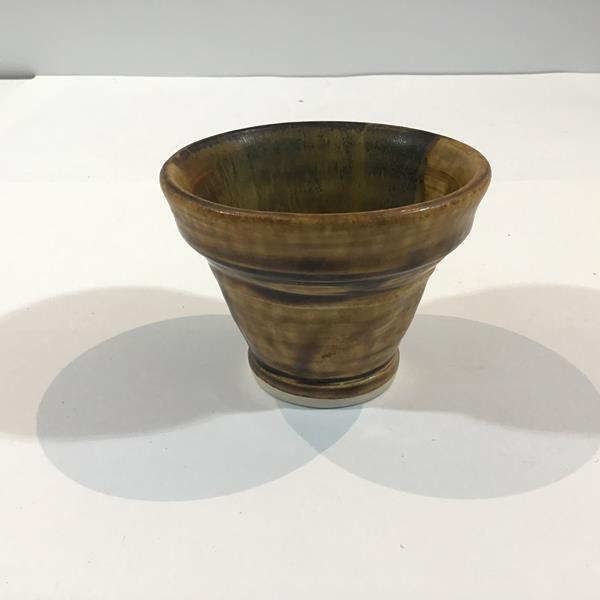 A Chinese bowl, of tapering cylindrical form, in a Tang style drip glaze, unmarked. Height 7.25cm