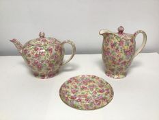 A 1950s Royal Winton Grimwades Chintz English Rose pattern teapot and lidded water jug and a 1940s