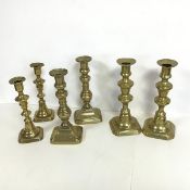 A collection of six baluster form candlesticks, all in pairs, one engraved D.D to base, the other