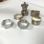 An assortment of five Birmingham silver napkin rings all with engine turned decoration by various