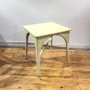 A 1940s Lloyd Loom style table, the square top with braided border, above an arched recess and bound