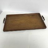 A two handled oak tea tray with raised moulded edge (60cm x 35cm)