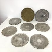 A set of nine large coasters, with floral and C scroll decoration, with felt to base (each: d.