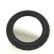 A modern porthole style mirror, the circular plate within an ebonised frame surrounded by brass