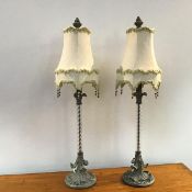 A pair of modern table lamps of Corinthian column inspired form, with synthetic spiral stems, on a