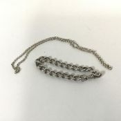 A silver chain link bracelet with a swivel clasp (9cm) and a silver chain link necklace with a