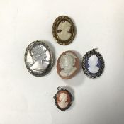 A set of five cameos including a resin cameo of Queen Elizabeth and the Duke of Edinburgh, another