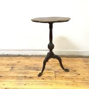An early 20thc. mahogany wine table of George III design, the circular quarter veneered top with