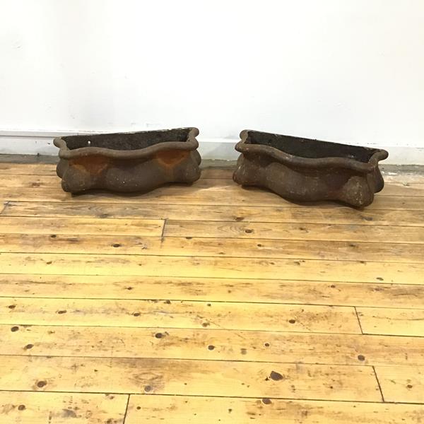 An unusual pair of Victorian cast iron hoppers of bombe form (20cm x 60cm x 22cm)