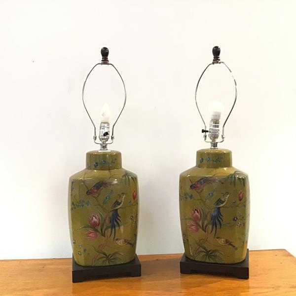 A pair of modern table lamps of tea cannister form, decorated with a mottled spinach green field,