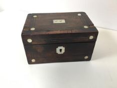 A 19thc rosewood jewellery box with mother of pearl inlay, the rectangular top with central mother