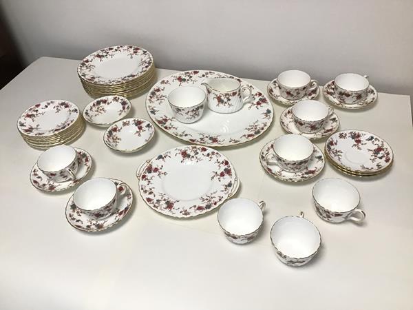 A Minton Ancestral pattern teaset including nine cups and saucers, eight small plates, nine larger