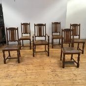 A set of six Edwardian oak dining chairs, to include one elbow chair, each top rail carved with