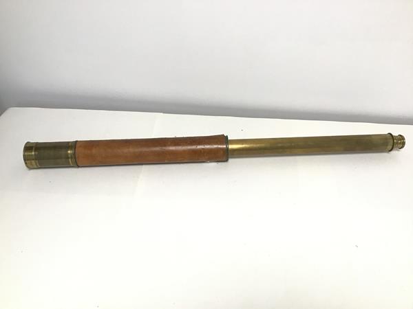 An early 20thc single draw telescope, stamped A.Carrick, Glasgow, some damage to leather (l. 90cm)