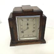 A 1930s Hamilton & Inches , Edinburgh Art Deco style mantel clock, the rectangular metal dial with