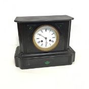 A late Victorian slate mantle clock with green stone inlaid decoration, the circular enamelled