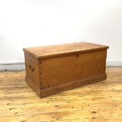 A Scottish pine kist, late 19thc., the hinged rectangular top enclosing an open interior with