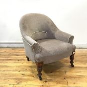 A Victorian mahogany framed tub chair, the hoop shaped back upholstered in patterned grey fabric